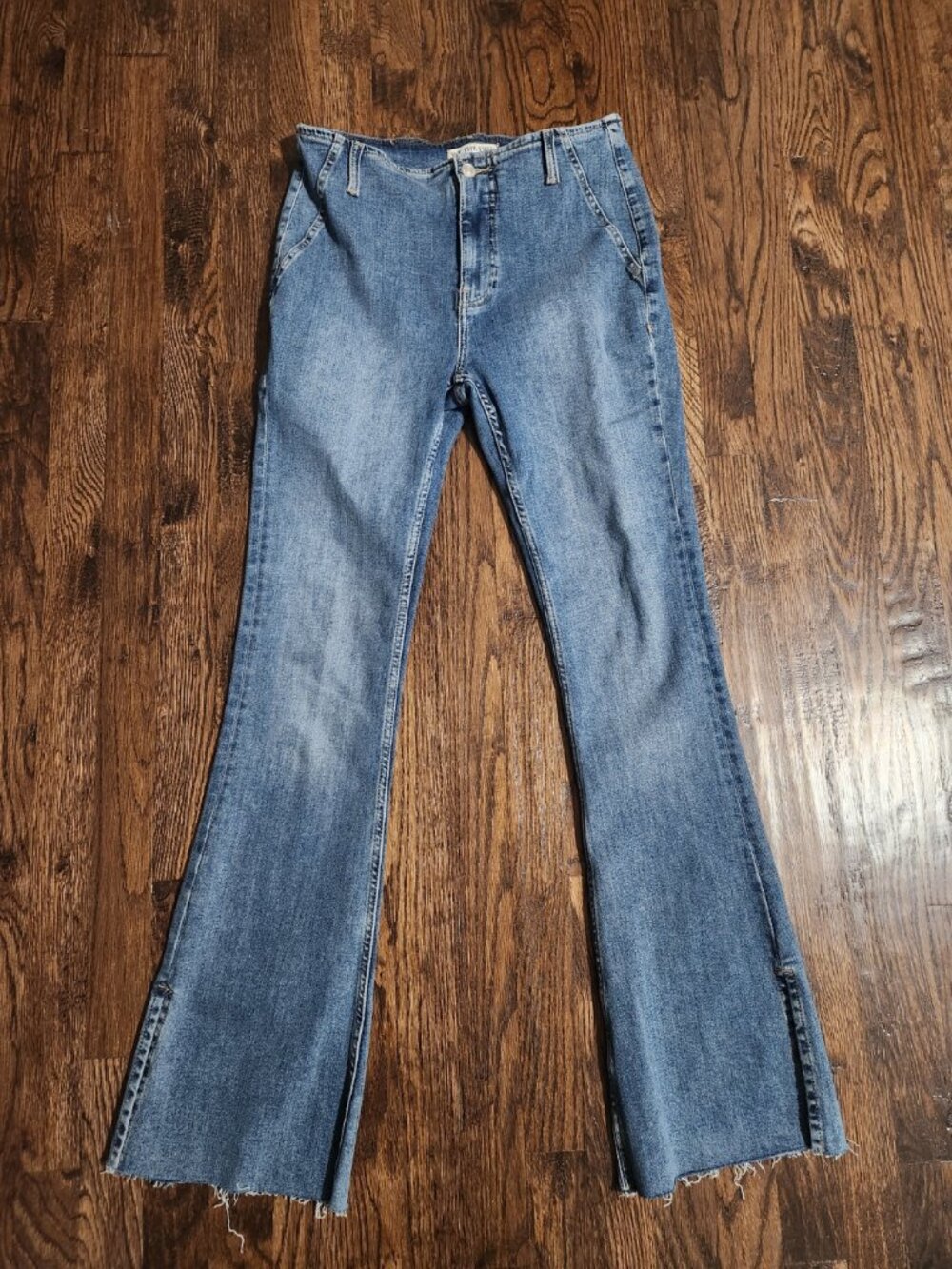 We The Free Blue Flare Jeans Distressed Hem Non-functioning front pocket size 29